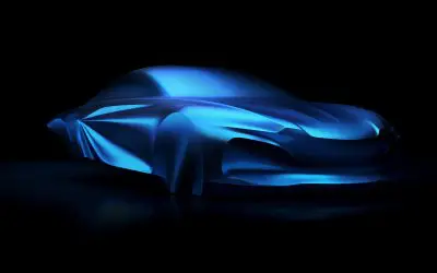 Alpine A110 treca generacija, skulptura pod plavim velom, pogled iz prednjeg ugla