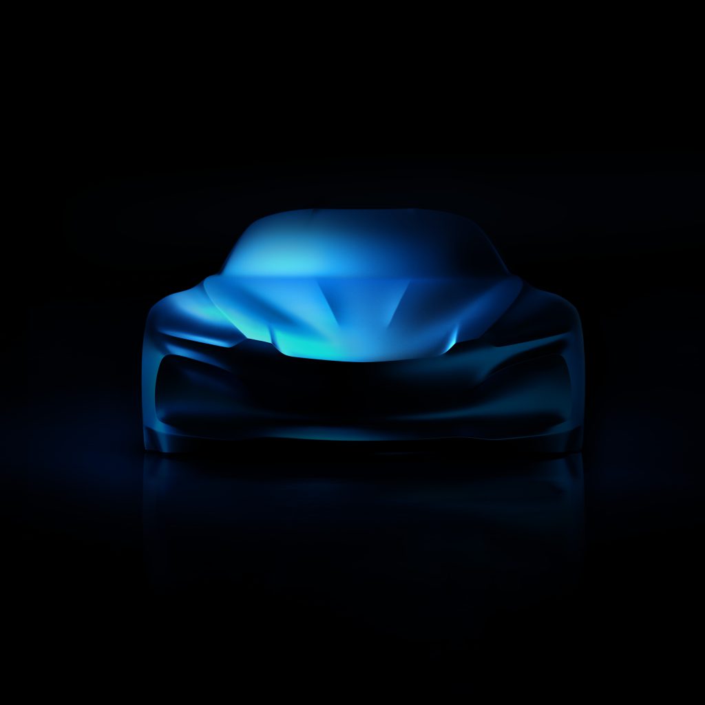 Alpine A110 treća generacija, skulptura pod plavim velom, pogled pravo spreda